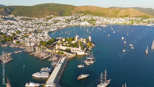 Bodrum, Turkey. Aerial view of Bodrum Castle, a medieval stone fortress on a rocky peninsula, with yachts in the harbor and whitewashed houses on hills under clear sky. Aerial View, MasterShots, Circ