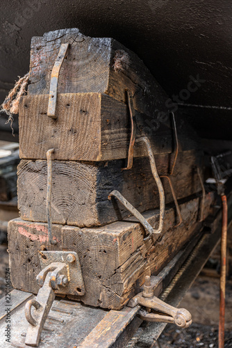 Obraz na plátně Stacked wooden keel blocks providing essential support to a large ship's black h