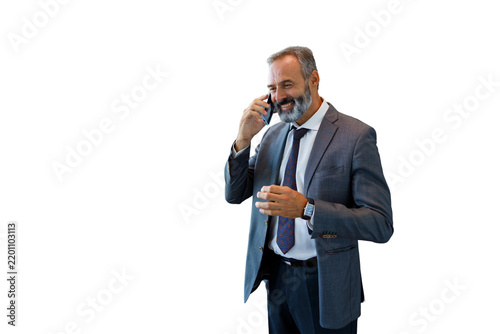 Mature businessman communicating on mobile phone, transparent background