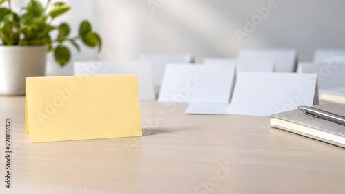 Yellow priority card standing out among blank white cards on desk