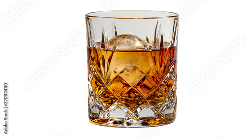 Amber whiskey in a crystal cut glass tumbler with a large round ice sphere