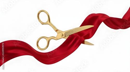 Golden decorative scissors cutting through red velvet ribbon with elegant sheen