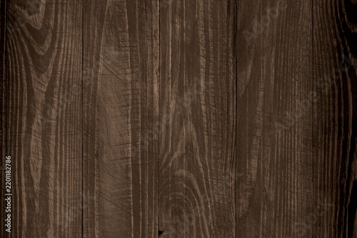 Fotografie Dark rustic wooden background featuring vertical planks with natural grain patte