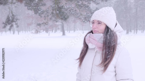 Woman outdoor calm. Female looking aside during snowy day. Peaceful solitude concept.