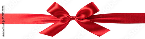 Obraz na plátně Red satin ribbon bow gift wrap isolated on white background