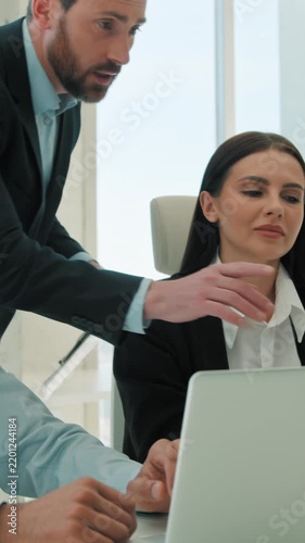 Multiethnic business team partners working with laptops indoor office coach mentor boss helping employees diverse ethnic coworkers interns explaining data project teamwork corporate meeting support
