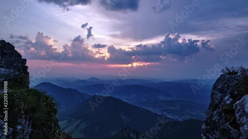 Timelapse Of Sunset Rays And Clouds Over Mountain Range From Rocky Peak