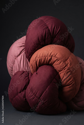 Abstract sculpture of soft quilted fabric forms.