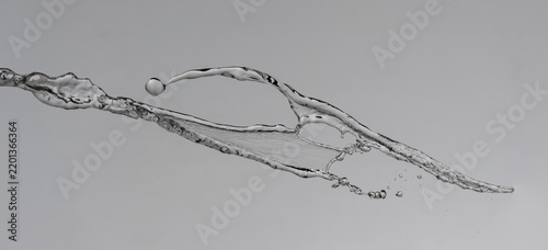 clear water splashes on grey background