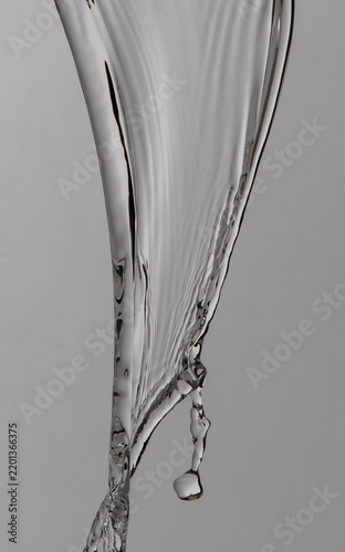 clear water splashes on grey background
