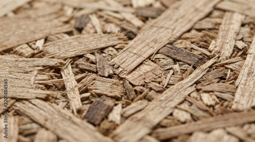 Fototapeta premium Macro texture of particle board wood chips. Close up of composite construction material