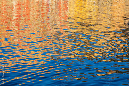 Ripples and colorful reflections on water in bastia corsica