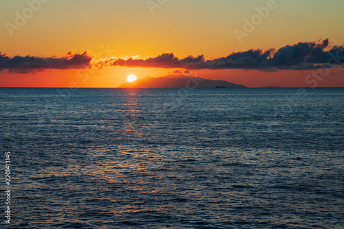 Sunrise over the Isle of Elba with sea and clouds
