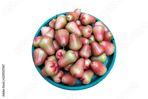 Fresh and colorful wax apple or rose apple or jamrul fruits served in a bowl isolated