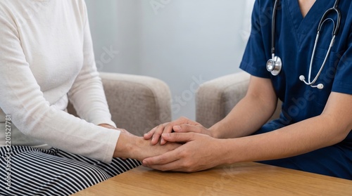 Caring healthcare professional providing comforting emotional support to a patient, holding hands during a medical consultation to build trust and empathy