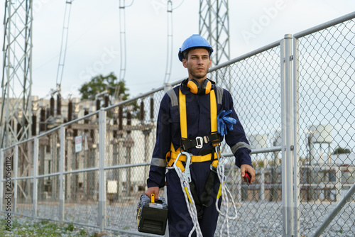 Electrical technicians are inspecting the operation and power distribution system within the substation that receives energy from the wind farm.