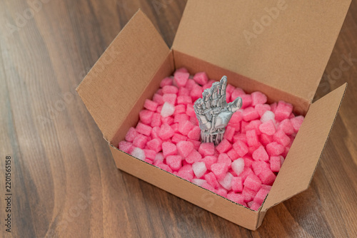 Robotic Hand Emerging from Heart Filled Gift Box, Futuristic Love Concept