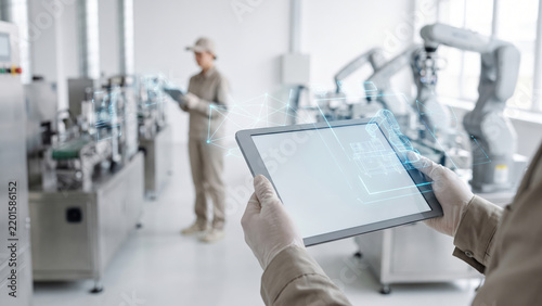 Ai industrial technology tablet ai industrial technology tablet illustrates connected automation clean factory with robotic arm and worker
