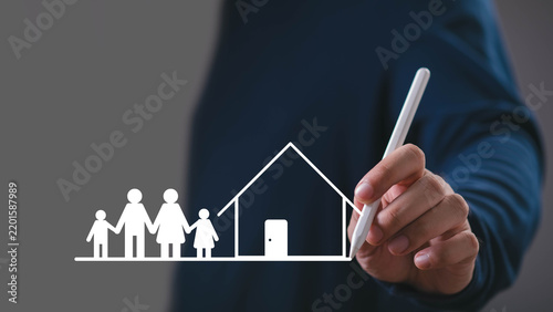 Home ownership and family protection concept, a professional drawing a house with a family symbol, representing real estate, property planning, mortgage, housing, investment, and financial stability.
