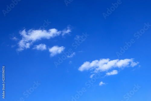 Blue sky with soft white clouds on clear day