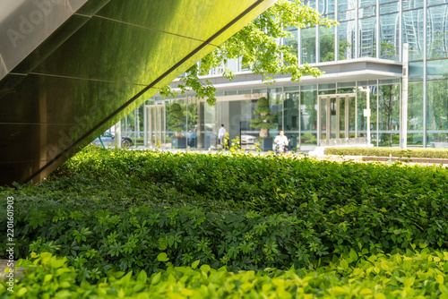 Urban office building with lush green landscaping