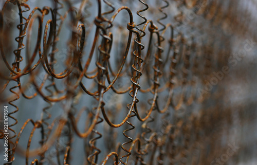 An old metal structure with traces of rust and a pronounced texture, shown in close‑up.