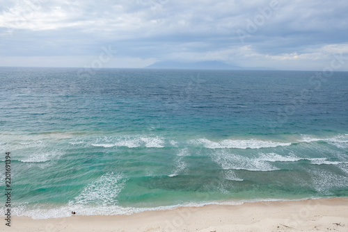 Fotografie Aerial view of Backside Beach (Dolok Oan) with turquoise water near Cristo Rei i