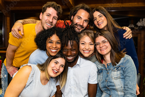 Obraz na plátně Diverse friends smiling and posing together indoors, celebrating friendship, connection and diversity