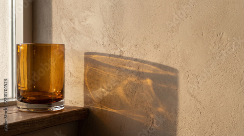 Amber Glass Shadow on Beige Wall | Warm Minimal Background