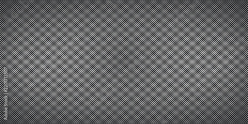 Monochrome halftone diamond dot pattern with white gradient on charcoal.