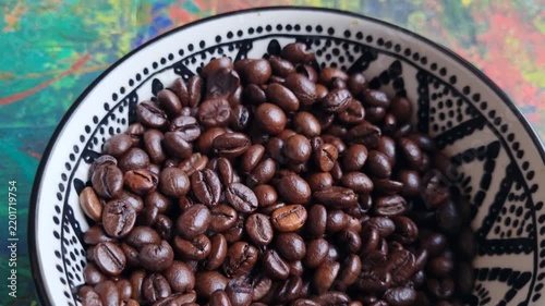 Coffee beans in a ceramic bowl. 