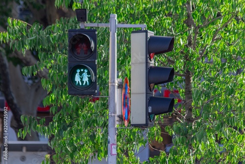 Pedestrian traffic light showing two figures holding hands with heart