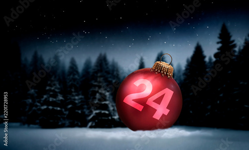 Obraz na płótnie Rote Weihnachtskugel in einem verschneiten dunklen Tannenwald