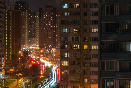 Nighttime cityscape with high-rise residential buildings and  road