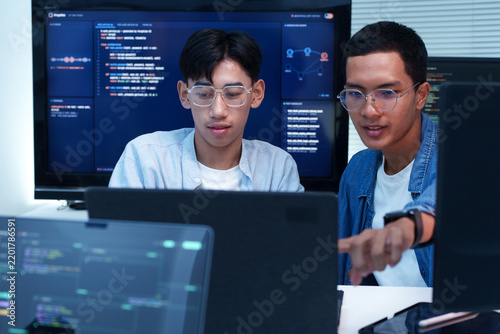 Programmers Collaborating on Software Development and AI Code