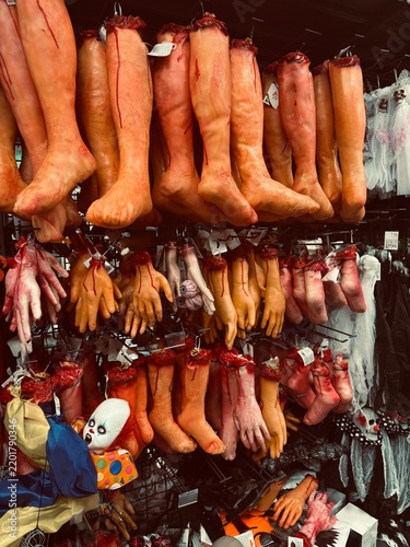 Quadro su tela Bloody fake severed limbs hanging on Halloween store shelf