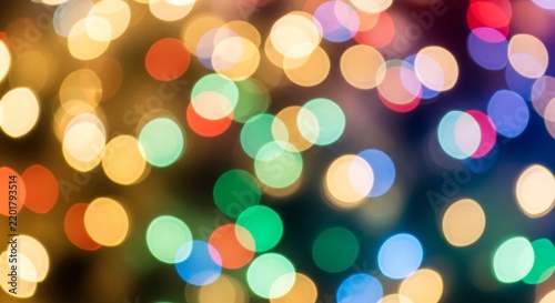 Abstract colorful bokeh lights background for festive celebrations.