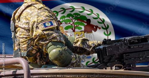 Фотография Belize flag with soldier at machinegun turret