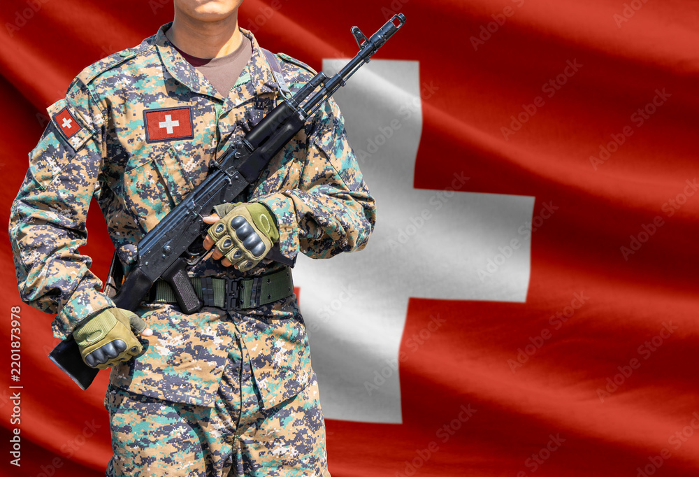 Obraz premium Switzerland flag with soldier holding assault rifle
