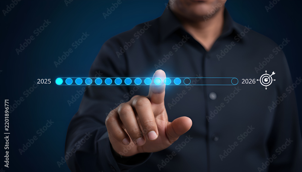 Obraz premium Businessman interacting with a digital progress bar interface representing the transition from year 2025 to 2026