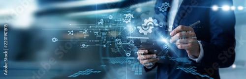 Fotografie Systems administrator working on tablet configuring advanced network settings panels, adjusting user access permissions, updating system security configurations, and managing device profiles