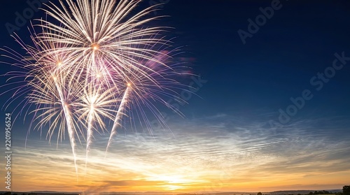 Colorful fireworks exploding brightly in twilight sky with sunset horizon with fireworks bursts vibrant trails against twilight sky fading sunlight sky illumination colorful lights twilight scene