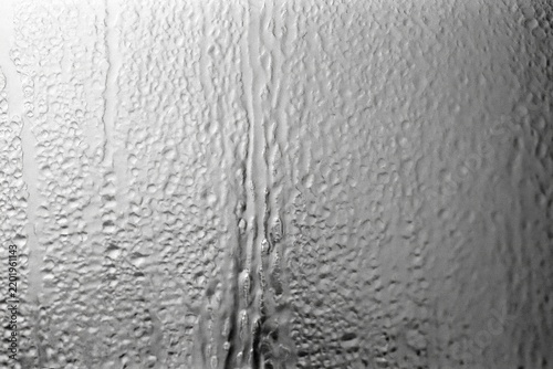 The Window Covered in Condensation With Vertical Drips and Soft Textured Glass