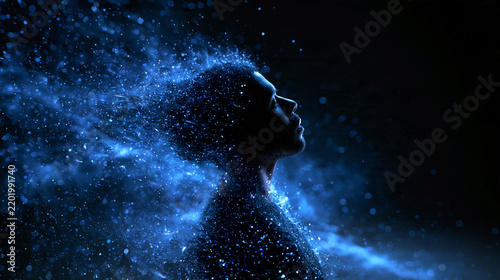 Profile of Man Dissolving into Glowing Blue Particles