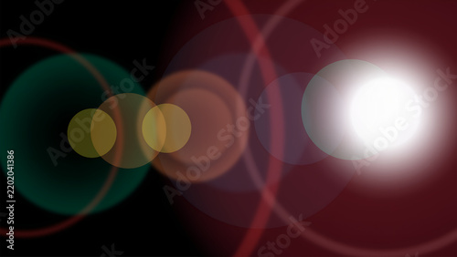 Abstract lens flare effect with colorful bokeh lights green yellow white glowing circles on black background optical flare