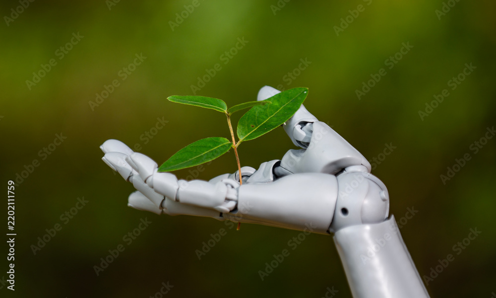 Obraz premium Robot hand with plant. Robot hand with plant. Green technology and AI. Robotic hand and environment. Eco biotech concept. Growing plant in robot hand on green background. Environmental technology.