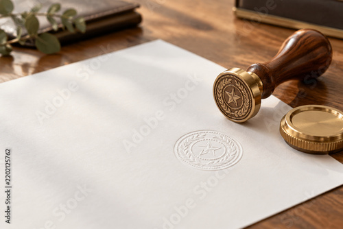 Notary stamp and embossed seal on paper, notarize legal certification and contract concept