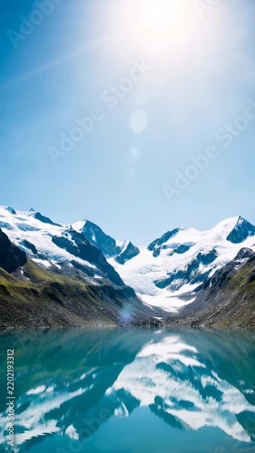 Serene Mountain Lake Reflection Under Bright Blue Sky