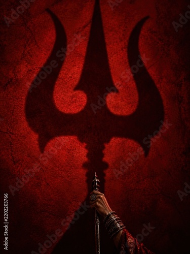 Shadow of a Trident on a Red Textured Background