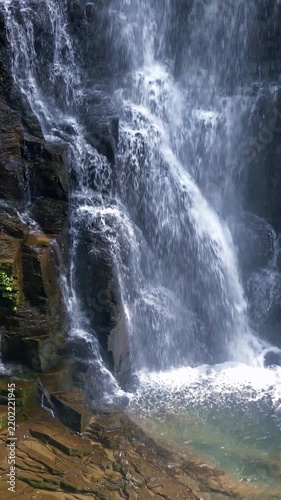 Sunlight Behind Curtain of Waterfall Vertical Video
